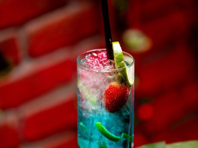 iced blue lagune cocktail with fruits